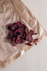Baked beetroot slices with sea salt. Vegetarian diet recipe. Healthy homemade chips. Copy space