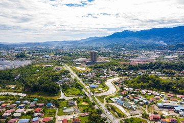 Aerial drone image of beautiful rural town of Menggatal Town, Sabah, Malaysia