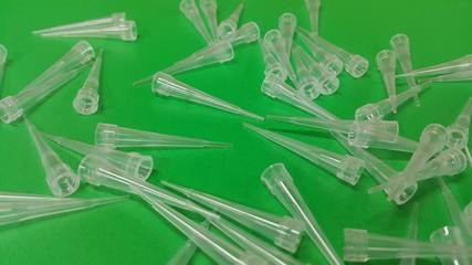 Close up view of micro litre tips on green floor