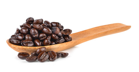 Obraz premium coffee beans in wooden spoon isolated on white background