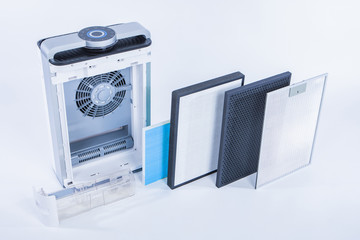 Disassembled air purifier closeup. Home air conditioning. Replaceable filter. Replacement...