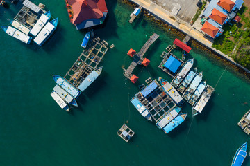 Aerial image of local lifestyle fisherman boat parking at fresh seafood market jetty at Kudat,...