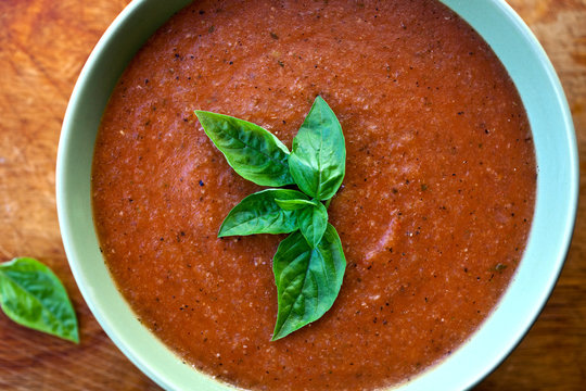 Overhead View Of Provencal Tomato And Basil Soup Served In Bowl