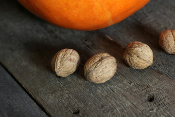 Walnuts on wooden background close up