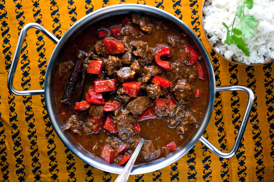Overhead view of pork vindaloo in casserole