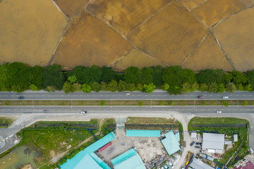 Aerial view of beautiful paddy field surrounding by small town at Penampang, Sabah, Borneo 