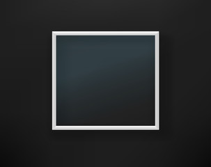 Empty white frame with glass on black wall