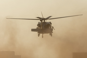 Military chopper invasion it takes off in combat and war flying into the smoke and chaos and...