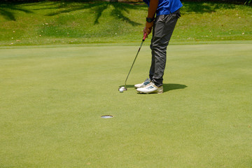 Golfer playing golf in beautiful golf course in the evening golf course with sunshine in thailand