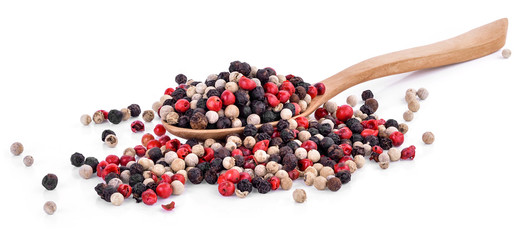 Mix from  kinds of pepper and  spoons isolated on white