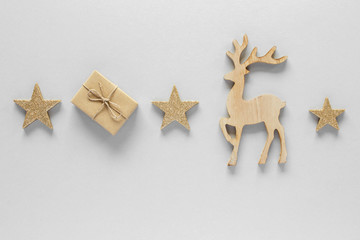 Fototapeta na wymiar Christmas composition. Reindeer star gift top view background with copy space for your text. Flat lay.