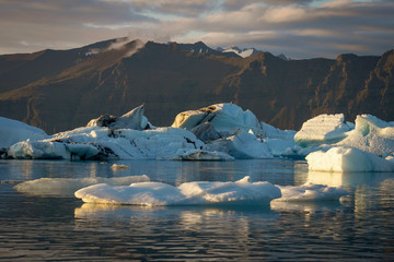 Ice bergs/chunks and glacier at jokulsarlon/fjallsarlon glacier lagoon. Iceland and travel concept.