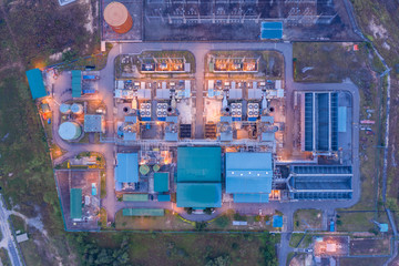 Aerial image of Electricity transmission sub-station and power plant during sunrise at Sabah, Borneo