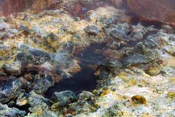 Bubbling hot water from the ground in geothermal area in Iceland. Power, hot, powerful, sulfur, texture concept.