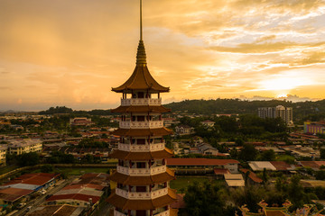 Aerial view of Chinese Temple Peak Nam Toong Pagoda during twilight sunset located in the city of...