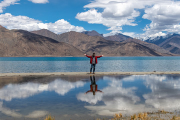 Traveler man enjoy Pangong Lake (Pangong Tso) Merak, Leh, Jammu and Kashmir ,India.