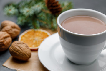 White cup with cocoa on a Christmas background