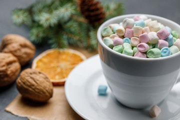 White cup with cocoa and Marshmello on a Christmas background