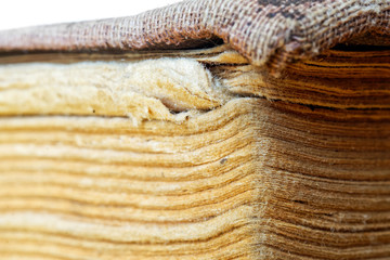 Damaged by mold and insects an old book from the library or a collection of documents from the...
