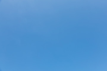Naklejka na ściany i meble View of clear blue sky under sunlight on summer day.