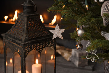 Magic Christmas tree decorated with beautiful silver balls. Nice composition and fireplace on the background. 
