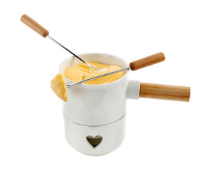 Pot of tasty cheese fondue and forks isolated on white