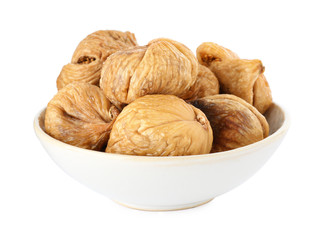 Bowl of dried figs on white background