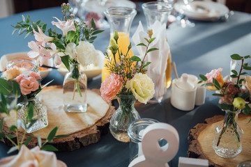 decorations made of wood and wildflowers served on the festive table