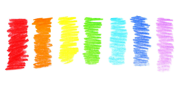 Rainbow drawn with colorful pencils on white background, top view