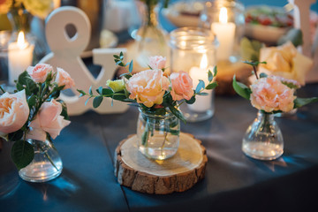 decorations made of wood and wildflowers served on the festive table