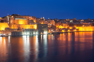 Fototapeta na wymiar Night view to Valletta Waterfront and Upper Barrakka Gardens. Grand Harbour, Malta