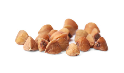 Buckwheat grains isolated on white. Organic cereal