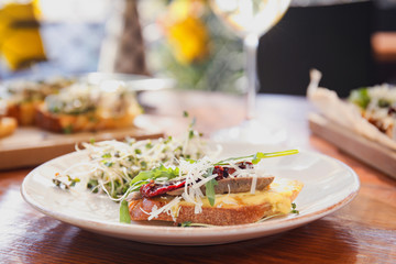 Delicious bruschettas served on wooden table in cafe