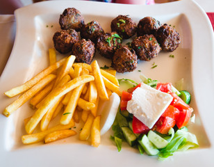 delicious fish cooked on the grill behind the plate