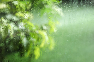 Window glass with rain drops as background, closeup