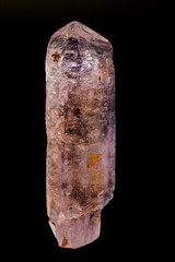 macro mineral amethyst stone on a black background