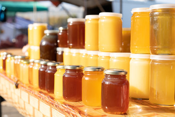 Honey on the counter for sale.