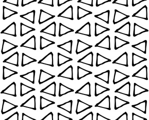 Black and white geometric abstract background. Seamless abstract doodle triangle geometrical print. Ethnic, tribal african in Doodle style. Boho paper, textile print. Repeated triangles ornament