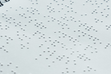 Braille font on paper. Close-up. Children's book...