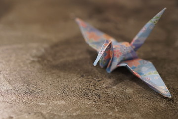 Fototapeta na wymiar Colorful origami crane with copy space