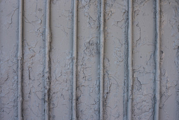 Textured surface of old painted metal wall.