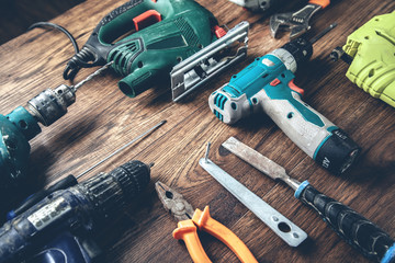 different tools on the wooden desk - obrazy, fototapety, plakaty