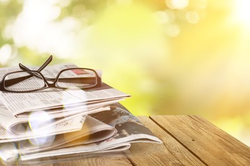 Pile of newspapers on white background
