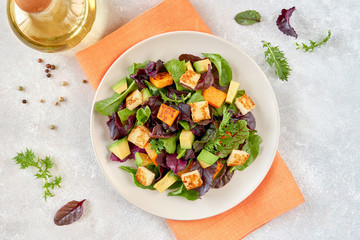 Salad with roast pumpkin , grilled halloumi and avocado
