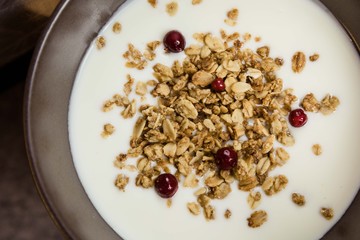 Healthy breakfast with muesli in banana yogurt top view