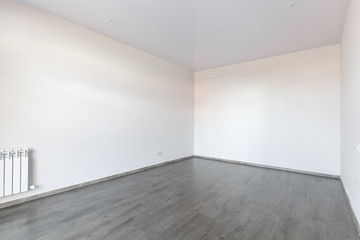 unfurnished house or apartment in bright colors with a dark floor
