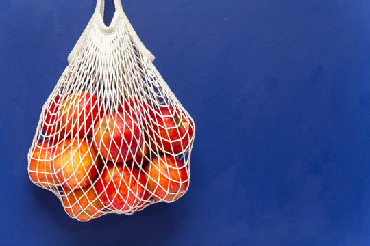 Red Apples In A Mesh Cotton Bag