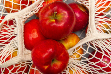 Red apples in a reusable bag mesh