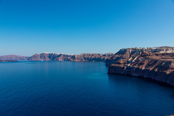 A cruise ship on the blue Aegean Sea near Santorini Island in the Greek Islands