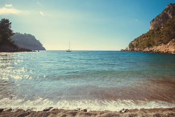 Beach with turquoise water and rocks